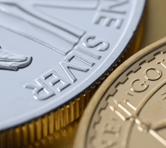 Silver bars and coins showing precious metals